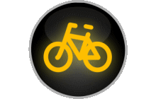 Svět. signály „Signál žlutého světla ve tvaru cyklisty“. Signály „Signál žlutého světla ve tvaru cyklisty“, jimiž je doplněn signál se zelenou šipkou směřující vpravo nebo vlevo, upozorňují řidiče, že při jízdě směrem, kterým tato šipka ukazuje, křižuje směr jízdy přejíždějících cyklistů. TestImage